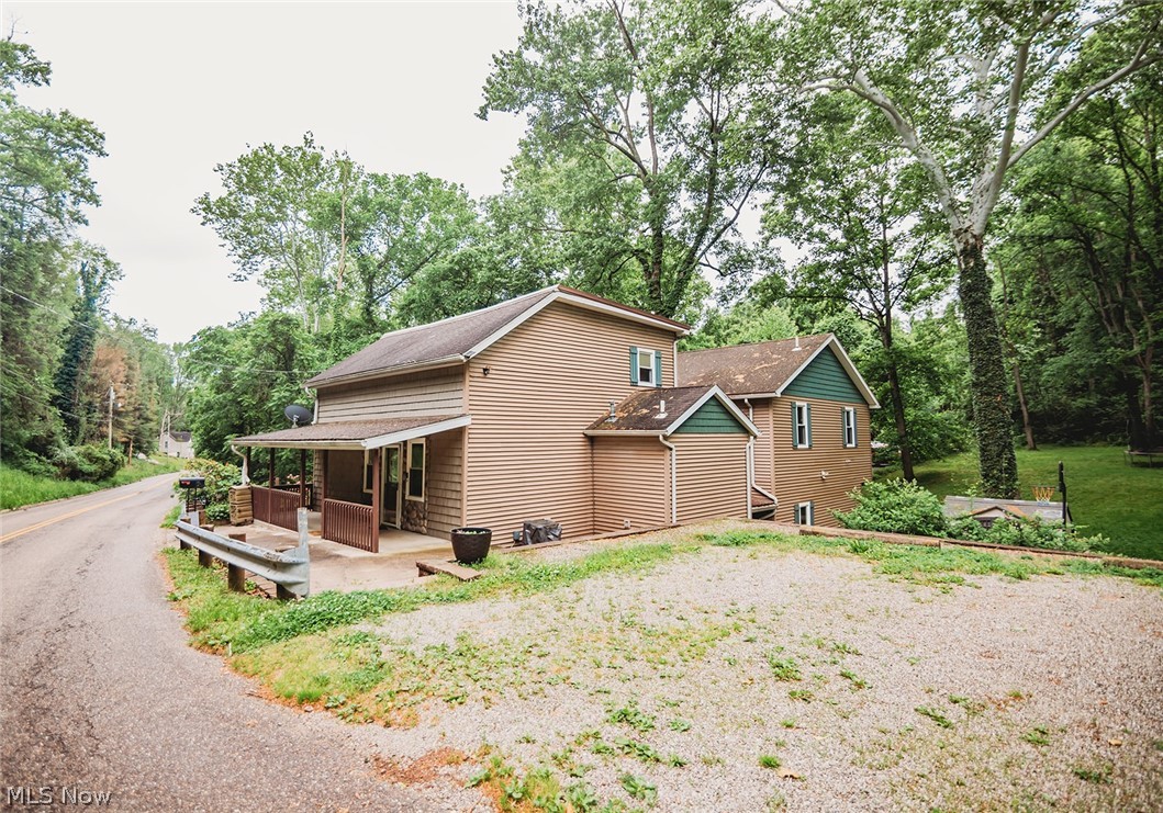 Charming 4 Bedroom, 3.5 Bath Home Just Outside Downtown Marietta!
Welcome to this spacious and versatile home nestled on three lots just outside the city limits — offering the perfect blend of convenience and country living! Situated a short distance from the heart of downtown Marietta, Ohio, this property delivers room to grow, room to roam, and endless possibilities.
Step inside to find a welcoming living room to your left, leading into a large, well-appointed kitchen boasting generous cabinetry — perfect for the home chef or entertainer. A convenient laundry room and half bath round out the main level nicely.
Head upstairs to discover an additional living area, a private bedroom, a walk-in closet, and a full bath — ideal for guests or family. The incredible loft level features its own full bath and offers flexibility as a private home office, studio, or luxurious master suite retreat.
The lower level provides even more living space with 3 bedrooms,  a spacious rec room or secondary living room — you decide how to make it your own!
Outside, the property truly shines. Spread across three generous lots with no city restrictions, there's ample room for outdoor living, gardening, or simply enjoying the fresh air. And for the hobby farmer or backyard enthusiast — the chicken coop is ready and waiting for its new flock!
Don't miss this unique opportunity to own a flexible, multi-level home with small-town charm and wide-open potential.