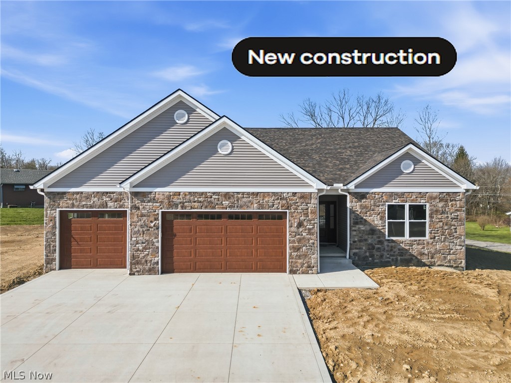 New Deluxe Construction, stone facade, 3-car garage; 
Attractive Exterior features Covered Porch, Multiple Window display; 
Kitchen includes Large Island, Custom cabinets, Quartz countertop; 
2.5 Bathrooms Beautifully Tiled, Elegant Showers; 
Walk-in closets, Spacious eating area, Butler Pantry; 
Full Basement, Insulated 12 Course block walls, On Demand Water Heater!