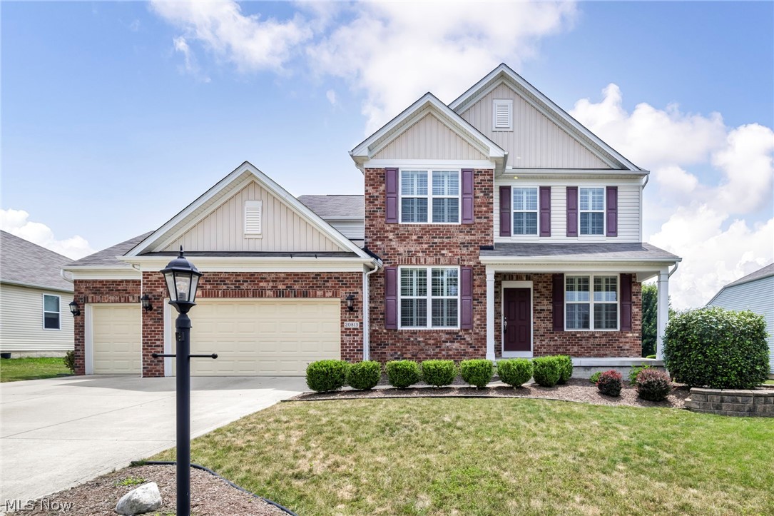 Welcome to this beautifully maintained 4 bedroom, 2.5 bath Colonial nestled in Strongsville's Fieldstone Preserve community, where timeless style, generous living spaces, & everyday functionality come together. Relax w/ your morning coffee on the charming covered front porch. The inviting foyer leads to the elegant formal dining room, beautifully appointed w/ wainscoting, crown molding, & a tray ceiling. The light-filled family room features a cozy fireplace & flows seamlessly into the spacious eat-in kitchen, creating an ideal layout for both everyday living and entertaining. The kitchen is sure to impress w/ a center island, granite counters, stainless steel appliances, abundant warm wood cabinetry & a walk-in pantry. A convenient planning center w/ a built-in desk that's perfect as a homework station, or organization hub. A versatile den offers endless possibilities as a home office, playroom, or hobby space, while the mudroom off the garage keeps daily life organized. Upstairs, a generous loft provides additional living space for movie nights & the 2nd floor laundry room adds everyday convenience. The spacious owner's suite features a private bath w/ walk-in shower, double vanity, & an expansive walk-in closet complete with custom built-ins. 3 additional bedrooms each include their own walk-in closets, & a shared full bath. The full basement offers abundant storage and endless potential to finish for even more living space. Outside, enjoy the fenced backyard featuring a patio that's perfect for summer barbecues. Car enthusiasts and those needing extra storage will appreciate the impressive 4 car tandem garage! Additional updates include plantation shutters (2017), primary closet built-ins (2016), and a backyard fence (2023). Conveniently located just minutes from shopping, restaurants, parks, and schools. Schedule your private showing today and discover everything this wonderful home has to offer!