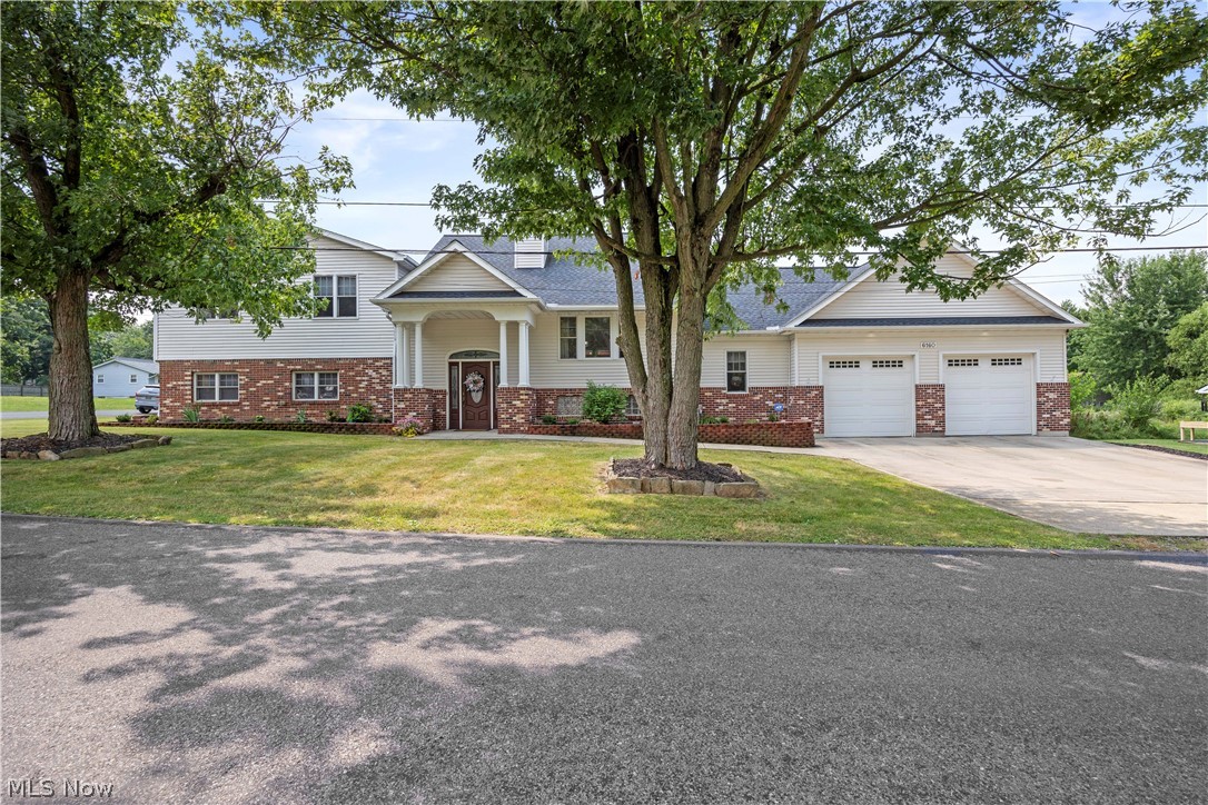 Prepare to be wowed! This absolutely gorgeous updated 3,205 sq ft split level in Elyria Township has everything you need and more! It is sitting on a total of three parcels with a lot size of 119 by 120. As you walk in the front door, you will be shocked at the stunning view! With a very large open foyer it leads to the first floor master suite which includes the ensuite bathroom complete with soaking tub, walk-in shower, dual sink vanity, walk-in closet and additional bifold closet. Also on the first floor is a large storage closet along with your spacious laundry room with linen closet and utility sink. As you walk up the stairs, you will enter the open eat in kitchen with dining area, large island with plenty of seating, solid surface countertops, stainless steel appliances, coffee bar and even a cocktail bar. This is all open to the great room complete with two story stone fireplace. On one side of the home you have the option to go into the mud room which leads to the garage and on the other side of the home you can go upstairs where you will find an add'l Master Suite complete with massive bifold closet, two add'l bedrooms with ample closet storage and a main bath for those to share. This home even has a basement that is ready for your finishing touches and includes a finished half bathroom as well. The four car garage is a dream at 26x42 ft with 11 ft ceilings and is heated and even has ceiling fans. has backyard access with an additional garage door. Now, let's talk about the outdoor living! With everything that this home has to offer you will never need to leave! There is a huge pool, wood deck with gazebo with ceiling fan and shades, hot tub and a vinyl fence which provides all of the privacy so you can enjoy your gorgeous backyard oasis! There is even an America's Pref Home Warranty for your peace of mind! Roof (2021). Paint, Wood steps refinish, Island refresh, Lighting with ceiling fans, Landscape (2025-26). Carpet (2022). H2O tank (2024).