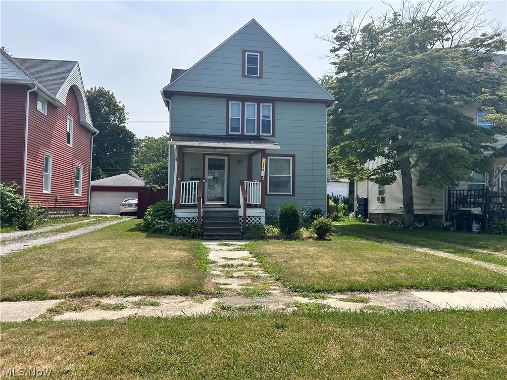 This 3 bedroom 1.5 bath Colonial style home has been well loved by the current owners, with major improvements over the years. Such as; total roof replacement of home and garage in 2001, in 2003 all windows in the home - including the attic - were replaced, furnace was replaced and central air was installed, AC was just serviced in 2025 & furnace was serviced with a fan replacement in May 2026 & in 2022 the hot water tank was replaced as well. The carpet in the living room was recently taken up to expose original hardwood floors - the same hardwood floors are also under the carpeting in the dining room, just waiting for you to restore them! Upstairs you'll find 3 bedrooms and the full bath to complete the inside living area. Outside you have a 1 car detached garage that has electricity, it's currently being used as an additional work area with storage overhead. Use the carport to park for easy access to the alley behind the home or have an outdoor hangout to enjoy your space!