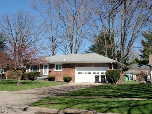 Brick beauty waiting for a new owner.  This home has been updated throughout the years and kept in good condition.  Berber carpet in all rooms except the kitchen.  We pulled back the carpet in living room and 1st bedroom closet to find hardwood flooring underneath. The kitchen has a good-sized dining area and there is room for additional cupboards and countertops.  All appliances are included with purchase. The first floor full bath has a shower over tub while the lower level bath has toilet, shower and sink.  Large, open basement could be finished to a nice rec room or playroom.  Home has vinyl replacement windows throughout, ceiling fans in living room and bedrooms plus central air and double closets in all bedrooms.  There's even a clothes shute in the bathroom.  Pull down steps in the garage to the attic.  Garage is a little deeper and has extra room for storage.  Covered patio at the back of home plus storage shed.  The surrounding properties all have chain link fences, so you cou