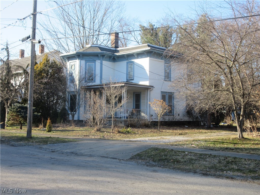 Two-story, four-bedroom, two-bath home built in 1890 blends historic character with the functional layout of a classic American family house.