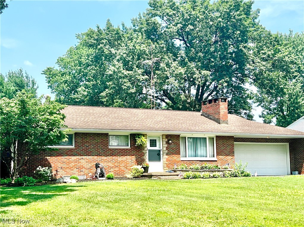 This spectacular brick ranch in Shrine Village features three bedrooms and two full bathrooms. The impeccable interior boasts a welcoming entry, neutral decor throughout, and a spacious living room with a custom white stone accent wall, a wood-burning stove, a large picture window, and plush carpeting. The gorgeous kitchen is equipped with quality cabinetry, a tile backsplash, stainless steel appliances, and ceramic tile flooring. The adjacent dining area offers direct access to a beautiful and spacious deck, overlooking a large backyard complete with a firepit and patio area. The finished lower level includes a recreation room, a built-in bar, a full bathroom, and a laundry area with a washer, dryer, and wash tub, along with ample storage space.  Additional features include; gas heat, central air, and city utilities. This property is a must-see and won't last long!  (may need extra possession time).