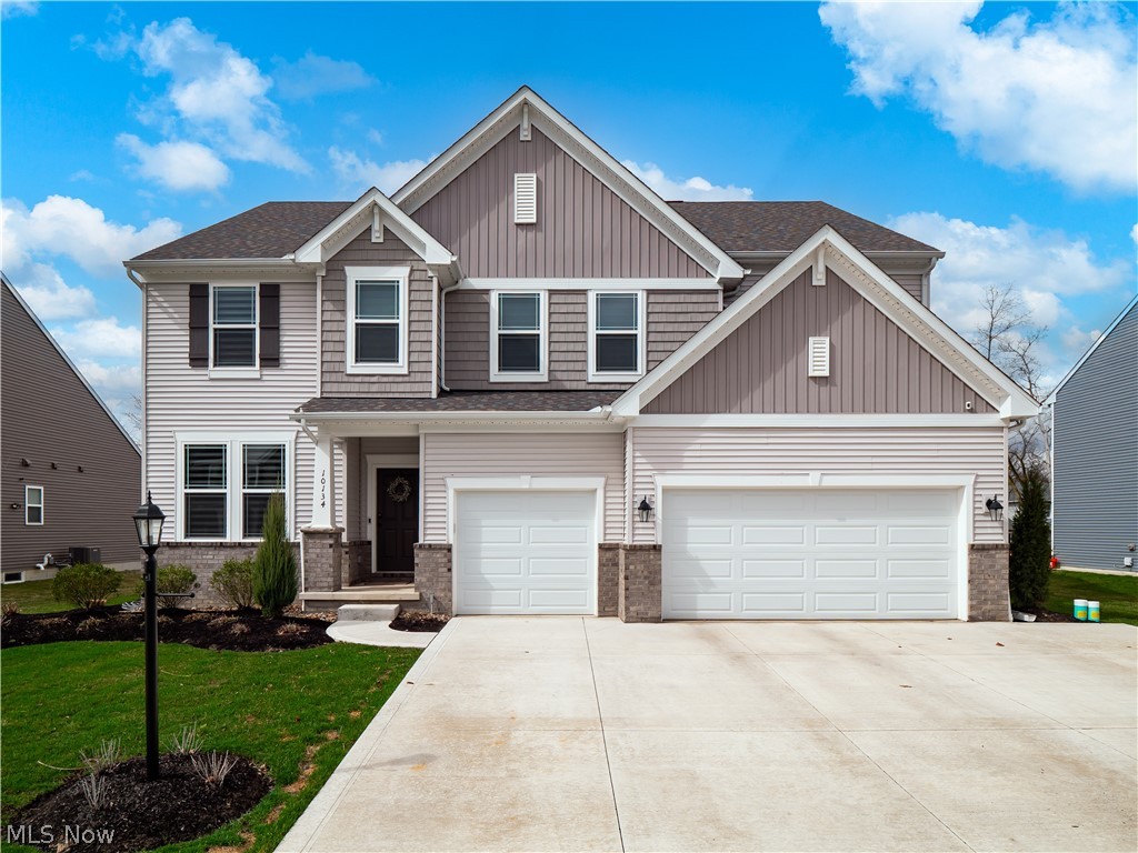 Exquisite New Construction in Strongsville with over $250,000 in upgrades, offering 4 bedrooms, 3 baths, and an unparalleled blend of luxury and thoughtful design.  All bedrooms are privately situated on the second floor, including a lavish owner’s suite with dual vanities, a spa-like shower, and two expansive walk-in closets, while a convenient second-floor laundry room enhances everyday living. Designed for both grand entertaining and refined comfort, this home showcases a stunning enclosed patio with fireplace, heaters, and an adjacent outdoor kitchen, along with a gourmet interior kitchen, custom finishes, and a spacious pantry.

Step inside to discover a serene, modern aesthetic with soothing, upscale finishes and laminate hardwood flooring flowing seamlessly throughout, including the beautifully finished basement. The lower level offers an impressive recreation space along with a dedicated private gym, creating the ultimate retreat for relaxation and wellness.

The main floor is thoughtfully designed with a stylish half bath, private office for work-from-home convenience, and a functional mudroom complete with custom lockers. The 3-car attached garage is a standout feature, boasting epoxy flooring, heat, a 200-amp EV charger, and built-in cabinetry.

Entertain effortlessly with a custom bar featuring a fridge and fridge drawers, while additional upgrades such as Hunter mechanical blinds, California Closets, a barn door with loft shelving, and a newly updated half-bath vanity elevate the home’s sophistication. The exterior is equally impressive, featuring fresh sod, professional landscaping, irrigation, and stunning gemstone lighting that enhances the home’s curb appeal day and night.

This exceptional residence offers a lifestyle of elegance, comfort, and modern convenience—truly a must-see.
