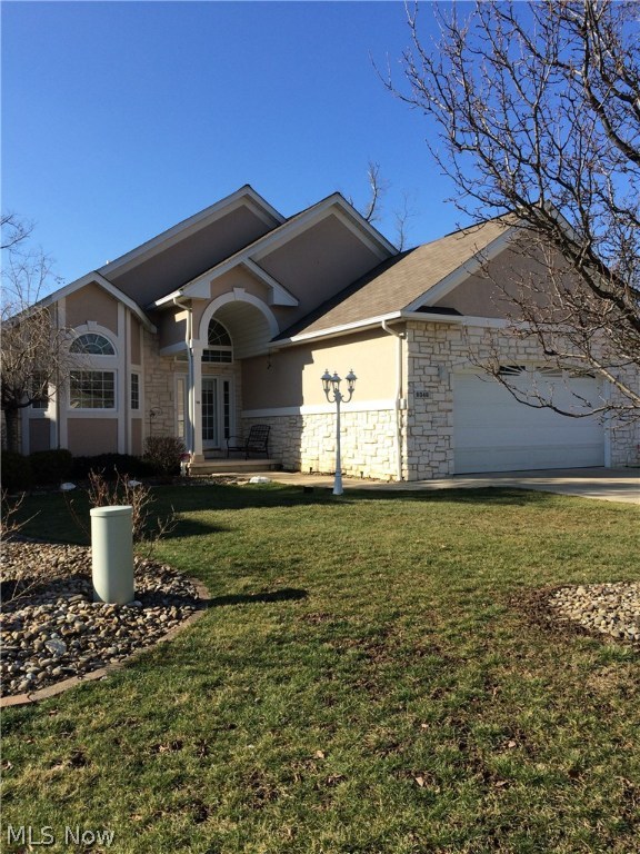 Pride in ownership! This beautiful home has been impeccably maintained & is virtually maintenance free! No expense has been spared! Features include vaulted ceilings, custom window treatments in every room, 36" doorways & halls, engineered wood floors w/30 year warranty, leaf guard screens, masonite 6 panel doors throughout, steel entry doors, photoelectric smoke detectors, & an alarm system w/motion detectors! The kitchen comes complete with stainless steel appliances! The master bath has an over-sized shower made from cultured marble! There is also an inviting spa tub in the master bath complete with his and hers sinks and a Sloan Flushmate commode! An additional half bath on the main level features a Toto high capacity commode! The full, finished walk out basement has a wet bar, a large entertaining area, a space large enough for workout equipment, a slider out to the cement patio! You will also find french doors leading to a bonus room that's perfect for an office! A walk-in storag