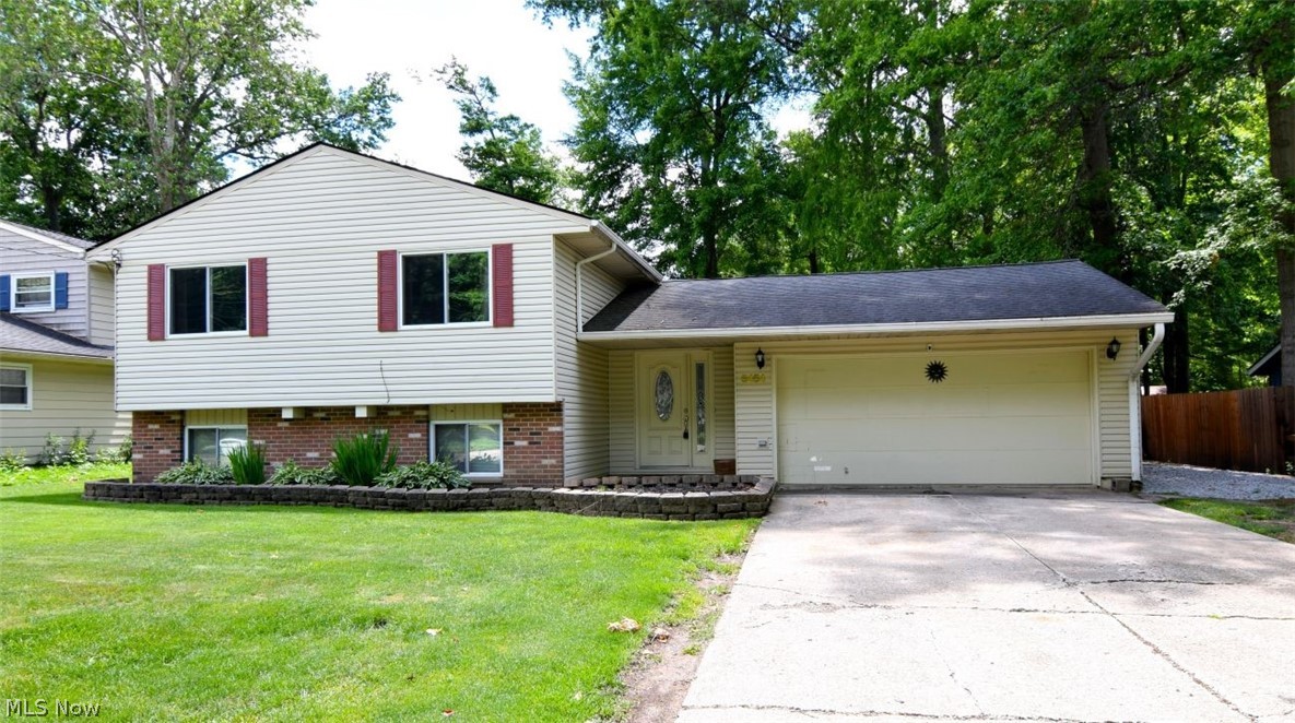 Welcome home to 5454 Barton Road in North Olmsted! This well-maintained 3-bedroom, 2 full bath split-level offers the perfect combination of space, functionality, and location. Step inside to an inviting open-concept living, dining, and kitchen area that's ideal for everyday living and entertaining alike. The kitchen comes fully equipped with all appliances included, making your move-in a breeze. Just a few steps down, you'll find a cozy family room featuring a fireplace—perfect for relaxing on chilly Ohio evenings. Need extra storage? This home delivers with garage attic storage, and a spacious 2-car attached garage. Outside, enjoy a large, flat backyard with plenty of room for play, pets, gardening, or future outdoor projects. A stone parking pad provides additional off-street parking for guests, trailers, or recreational vehicles. Conveniently located near major highways, commuting is simple while still enjoying a quiet residential setting. You'll love being just minutes from shopping, dining, and entertainment in North Olmsted, with easy access to neighboring Westlake and North Ridgeville. Whether you're looking for a flexible living space, or a fantastic location close to everything, this home checks all the boxes. Schedule your private showing today and discover all that 5454 Barton Road has to offer!