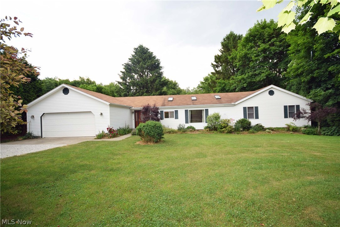 3 bedrooms, 2 full baths located in the Springfield LSD.  If you're looking for one floor living, private lot and lots of garage space this is the one. This home has been completely updated.  Beautiful oak cabinets in the kitchen with a breakfast bar.  Both bathrooms have double sinks.  4-car tandem garage.  Skylights located in the kitchen, living room, and bath to help bring in the natural light.  Walk-out double doors lead to the back of the house and provides a small deck for relaxing and drinking your morning coffee with great views of the private backyard.  Wait until you see it!  This home is easy to show and is ready for you to move right in!  Call today to schedule your showing!