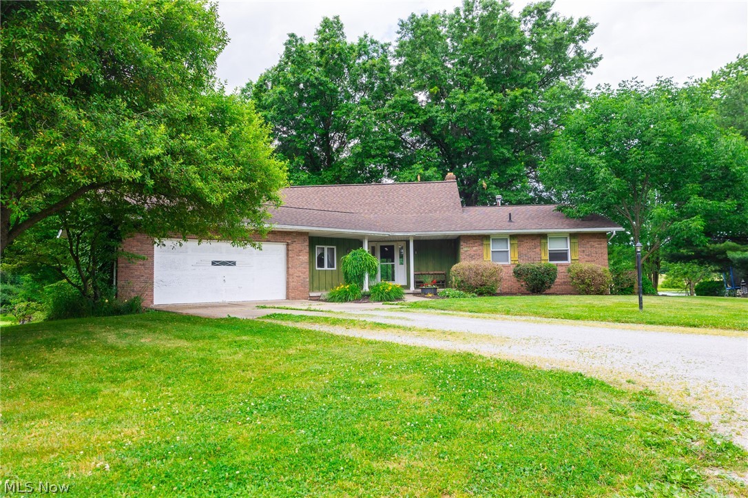 Onsite Absolute Auction, Tuesday July 21st at 6:00 P.M.
Parcel 1 features a well-maintained brick home built in 1976, privately situated among mature trees with lake views, a covered patio, and deck. The home offers 4 bedrooms, 3 full baths, a bright kitchen and dining area, a living room with a wood-burning fireplace, main-level laundry, and an attached 2-car garage. The walk-out lower level includes a kitchenette, living area, full bath, fireplace, and garage/storage space, providing excellent potential for an in-law suite or guest quarters. The property also includes a 24' x 40' pole barn with lean-to. Utilities include private well, septic, and natural gas heat. The parcel is part of the Hidden Lake HOA and served by a shared driveway.

Parcel 2 consists of 24.528 acres with approximately 12.4 wooded acres and the balance in productive tillable ground. The land features rolling terrain, established trails, recreational opportunities, and long-term timber potential. The tillable acreage is currently farmed, with the tenant retaining rights to the current crop. The parcel has its own access from Hidden Lake Drive and is also served by a shared driveway.