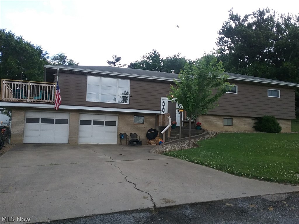 This is a must see!!! House is on a quiet, dead end street and is the last house on the street, very private.  Lots of rooms, lots of space and tons of storage.  This is a split entry home with Living rm, Eat in Kitchen, Dining rm, 3 bdrms and full bath on main floor.  Bdrms each with a minimum of 2 closets and 1 with 4 closets.  The pantry off of the kitchen has floor to ceiling cabinets.  The living room opens to a wood deck that overlooks the large, fenced yard thats almost 1/2 acre, great for children and pets.  Downstairs there is a large family room with bar, sink and fridge.  There is an additional room that currently houses a fourth bdrm and would make a great play room/ game room or remain a guest room.  An Addition to this room is a private office. The laundry/utility room is in the lower level and there is another full bath also.  Access to the oversized 2 car garage is from the lower level.  This home has mostly new flooring and lighting throughout.  Drive way is paved.  50