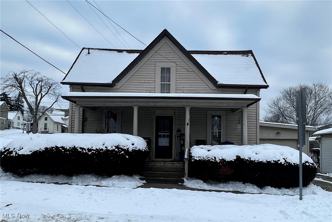This cozy 3-bedroom, 1.5-story home has been a reliable long-term rental and is currently occupied by a long-term HUD tenant who has resided in the home for 12 years. The main floor features one bedroom and a full bath along with comfortable living space, while two additional bedrooms are located upstairs. Enjoy outdoor living with a covered front porch and a covered back deck. The narrow 1-car garage offers extended depth, making it ideal for storage, a workshop, or tandem parking. With stable occupancy already in place, this property presents a solid opportunity for investors.