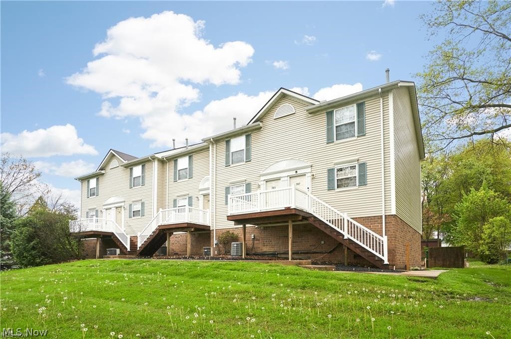 Rare 11-Unit Townhome-Style Apartment Building in Cuyahoga Falls. Fully occupied, creating an excellent investment opportunity in the heart of The Falls! This well-positioned 11-unit apartment building offers a highly desirable townhome-style layout, giving each resident the privacy and convenience of their own individual entrance-no shared lobby or interior hallway access needed. Each unit features approx. 1000 sq. ft. with 2 bedrooms, 1.5 baths, a private laundry hookup, and its own attached one-car garage, creating a comfortable and practical living experience that tenants appreciate. Tenants are responsible for their own utilities, helping keep ownership expenses more manageable. Located near a wide variety of shopping, dining, and everyday conveniences, the building is also situated in vibrant Cuyahoga Falls - a community known for its energy, summer events, entertainment, and welcoming atmosphere. This is a standout opportunity to own a multi-unit property with a layout and amenities that set it apart from traditional apartment buildings. Please see MLS 5212556, 5212576 for additional apartment units for sale.