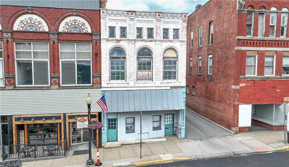 Bring your vision to life with this character filled commercial building in the heart of downtown Barnesville. Offering historic charm and a prime location, this property presents an excellent opportunity for investors, entrepreneurs, or business owners looking to create something unique. Filled with potential and original character, the building features beautiful exposed original brick interior walls that add warmth and timeless appeal. Per the owner, the second floor also features original hardwood floors beneath the current flooring, offering the opportunity to uncover and restore an appealing historic detail. Situated in a highly visible downtown location, this property could be well suited for retail, office, apartments, mixed-use development, or a variety of other ventures. A public parking lot located directly across the street provides convenient access for customers, clients, and tenants. Don't miss the chance to make this distinctive property your own.