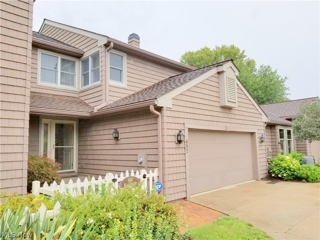 Enjoy lake living and beautiful views from all three levels of this condominium located in upscale Mariners Point!  Panoramic views of both the wast and North reservoir can be had from almost every room in this well maintained unit.  First floor boasts a soaring two story living room with wall of newer Pella replacement windows providing view of North Reservoir; updated kitchen with maple cabinetry, center island and stainless steel appliances with access to private deck with lake view; half bath and first floor laundry.  2nd floor features a spacious owner's suite with full bath with double sinks, walk-in closet and access to balcony with lake views; guest bedroom with walk-in closet; 2nd full bath and loft/office area with lake view.  Fully finished lower level features a rec room with wet bar and fireplace!  Updates include Pella replacement windows, newer ceiling fans and light fixtures, newer vinyl shake siding and new seawall (in condo common area).   Deeded dock included with un