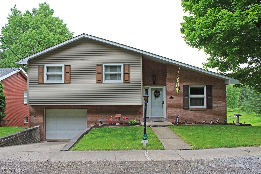Come Home to this lovely 3 bedroom, 1 1/2 bath multi-level home with hardwood floors, a gas fireplace in the rec room and a nice deck off the living room. Call for your showings today!