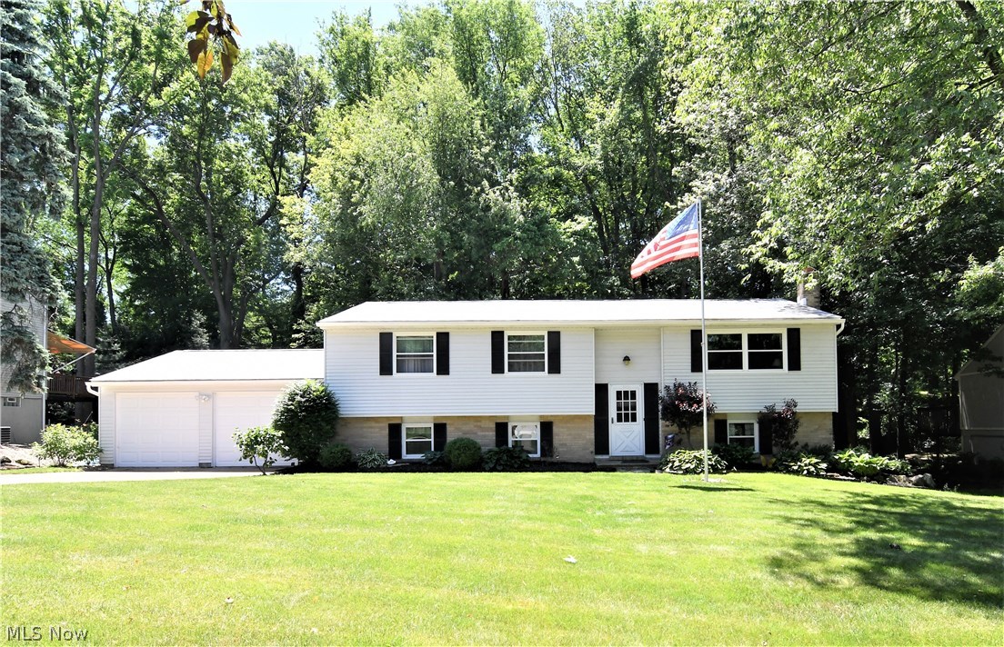 Opportunity to own this pristine home with quality workmanship throughout.  The home features a large living room and dining area.
The kitchen is large with plenty of cupboards and working space for the family chef.  The Sunroom is great for entertaining or relaxing
and enjoying the scenic backyard which also includes a large deck and jacuzzi.  You will find 4 bedrooms and 2 full baths.
The lower level features a large family room with fireplace, office, additional living place plus a large laundry room. The home has a newer
roof and windows. This is a fantastic home.  Don’t miss out out, nothing to do but move in and enjoy. Call for your private showing.