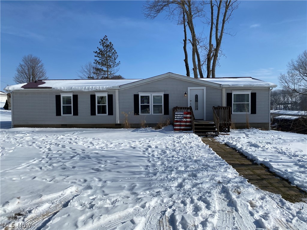 This is a meticulously maintained modular home with many new updates! Fresh paint, flooring, HVAC, all done in 2018. This cozy single story home is tucked in peaceful Village of Fredericksburg. You will enjoy the convenience of one floor living! This home features a dinning room, eat in kitchen with a island and bar seating. Well laid out floor plan with ample storage. 3 spacious bedrooms with 2 full baths. Separate porch entrance on side of home that enters directly into the laundry room, and nice sized deck out back. This little gem wont last long, schedule your showing today!