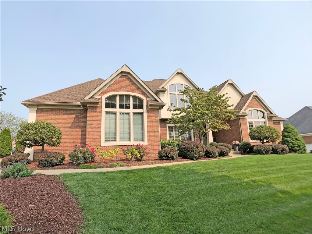 This beautiful home in St. James, custom-built by Doug Prestier, exemplifies Southern European design. Over 5,000 sq feet of finished living area includes an open 2 story foyer, dual staircases, a kitchen with Italian tile floors, granite counters, island with raised breakfast bar, walk-in pantry, and a separate dinette, a 1st floor master bedroom including a walk-out private deck, an ensuite bath with a Jacuzzi tub, walk-in shower, and large walk-in closet with stairway to oversized cedar closet on lower level, a spacious great room, an open dining room, 1st floor office, 1st floor laundry, and 1/2 bath. 2nd floor includes the 2nd and 3rd bedrooms with Jack and Jill bath featuring separate vanities and a large 4th bedroom with ensuite bath. The fantastic walk-out lower level offers a custom wet bar, game room, rec room, media room, and 1/2 bath - all perfect for entertaining. Other amenities include zoned heating, central vac, whole-house audio system, sprinkler system, an oversized 3