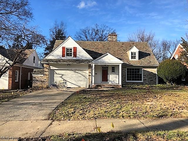 Beautiful Forest Hill home in Cleveland Heights just underwent extensive renovation, absolutely gorgeous & ready to move right in! Real Stone on the exterior compliments the freshness of brick & white exterior w/ stunning slate roof & many muted colors to flow for a curb stopping view! Home is much larger than it appears: Enter from the covered front porch to the Foyer w/ slate flooring & coat closet to see the Grand Living Room w/ beautifully refinished hardwood floors throughout the main living area, gorgeous fireplace, large windows & stunning trim throughout; wind around to the magnificent view from the true Dining Room open to the Kitchen & enclosed 3-season Sun Room w/ French Doors & lots of glass for amazing views of large back yard~ an addition in 2015 w/ wall AC; Kitchen has delightful full height white cabinetry accented by gorgeous granite countertops & Breakfast Bar along with slate stainless steel full appliance package & all the goodies you'd expect in this show stopper k