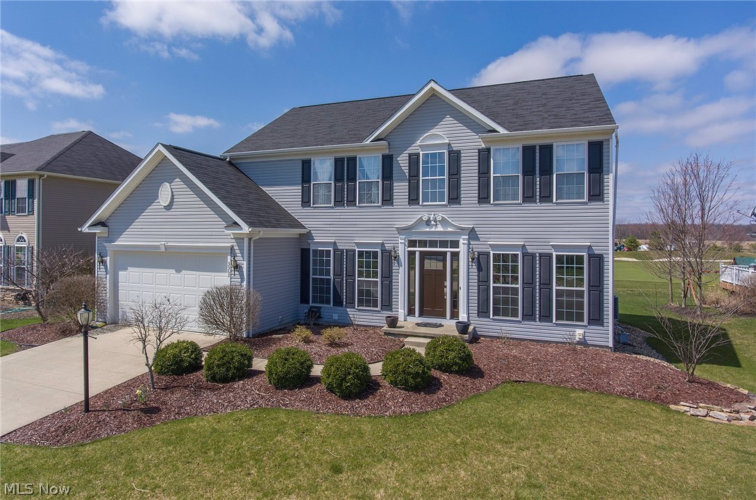 Distinct pride of ownership is found in this gorgeous, neutrally updated, 4 BR Colonial which backs up to the 4th hole of the Shale Creek Golf Course! New front door w/side lights enters into the 2 story foyer w/striking hardwood floors that flow into the private office w/french doors, family room w/floor to ceiling stone fireplace & a wall of windows, updated kitchen, formal dining room w/raised ceiling, wainscoting, crown molding & modish chandelier & formal living room. The updated kitchen is fully equipped with Kraftmaid cabinets (2017), quartz counter-tops, tile back-splash, all Kitchen Aid stainless steel appliances & custom floor to ceiling barn wood wall. 1st floor laundry & half bath have been updated w/ceramic tile (2018). The 2nd level offers 4 spacious bedrooms w/new carpet (2016). The master suite boasts vaulted ceiling, walk-in closet, updated master bath (2015) w/jetted tub & double sinks. Unfinished, insulated basement awaits your finishing touches. This freshly painted