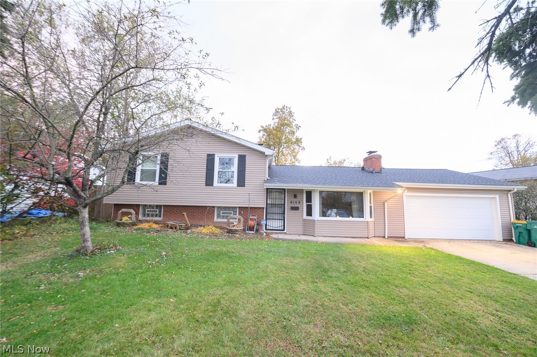 This spacious split level home features a surprise addition off the back giving you complete first floor living options including a first floor bedroom, bath, and utility room!  From the front entrance, you step into a large living room with bay window, brick fireplace and wood flooring that flows into the open concept of your eat-in-kitchen and great room with french doors leading to a patio and a fenced wooded rear paradise.  Going upstairs you'll find 3 more bedrooms and a full bath.  Then, going down a few steps, you have a large partially finished area for whatever extra room you may want or need in your new home. Other highlights include a an attached 2 1/2 car garage, 2 storage sheds, and access to Cedarwood Beach Club and Lake Erie.
