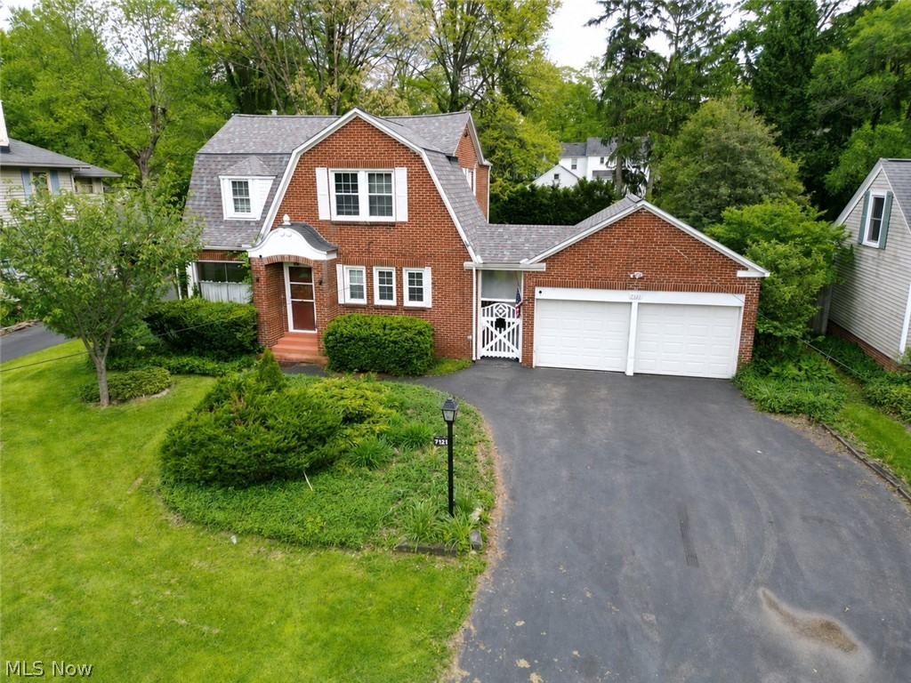 Welcome to this all brick, 3-bedroom home with tons of character in the Poland Local School District! Outside you'll notice the charm of this house but with a newer roof, siding, and downspouts as well as almost all updated windows (2017)! With over 1800 sq. ft., this home welcomes you into a living room with brick herringbone woodburning fireplace, real hardwood floors and a cute little room off this living space which would be good for an office, reading nook, or play area! The dining room has a new chandelier as well as hardwood floors and windows looking out to the private backyard! This leads into a huge family room with access to the outdoor patio! The kitchen comes with a fridge, dishwasher (2025), granite countertops and a cute eat-in area with tons of little storage cabinets! A half bath is just around the corner on the main level too! Upstairs has 3-bedrooms... one is a large bedroom with 2 closets; another has 3 closets and all with hardwood flooring! A full bathroom with tub/shower combo serves this level as well! The basement has a walk-out to the backyard, many different storage rooms and a laundry area with washer/dryer that stays! Outside is the 2-car garage which you can access through the covered breezeway that also leads into a huge storage area off the back of the garage. You heard it again- TONS of storage, great location, and lots of charm! Other updates include A/C 2025, chimney rebuild and flex-liner installed (2021), HWT 2022, and newer garage doors!