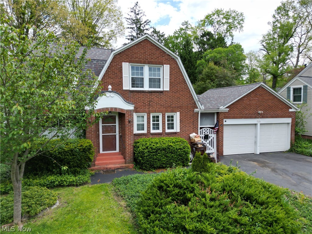 Welcome to this all brick, 3-bedroom home with tons of character in the Poland Local School District! Outside you'll notice the charm of this house but with a newer roof, siding, and downspouts as well as almost all updated windows (2017)! With over 1800 sq. ft., this home welcomes you into a living room with brick herringbone woodburning fireplace, real hardwood floors and a cute little room off this living space which would be good for an office, reading nook, or play area! The dining room has a new chandelier as well as hardwood floors and windows looking out to the private backyard! This leads into a huge family room with access to the outdoor patio! The kitchen comes with a fridge, dishwasher (2025), granite countertops and a cute eat-in area with tons of little storage cabinets! A half bath is just around the corner on the main level too! Upstairs has 3-bedrooms... one is a large bedroom with 2 closets; another has 3 closets and all with hardwood flooring! A full bathroom with tub/shower combo serves this level as well! The basement has a walk-out to the backyard, many different storage rooms and a laundry area with washer/dryer that stays! Outside is the 2-car garage which you can access through the covered breezeway that also leads into a huge storage area off the back of the garage. You heard it again- TONS of storage, great location, and lots of charm! Other updates include A/C 2025, chimney rebuild and flex-liner installed (2021), HWT 2022, and newer garage doors!