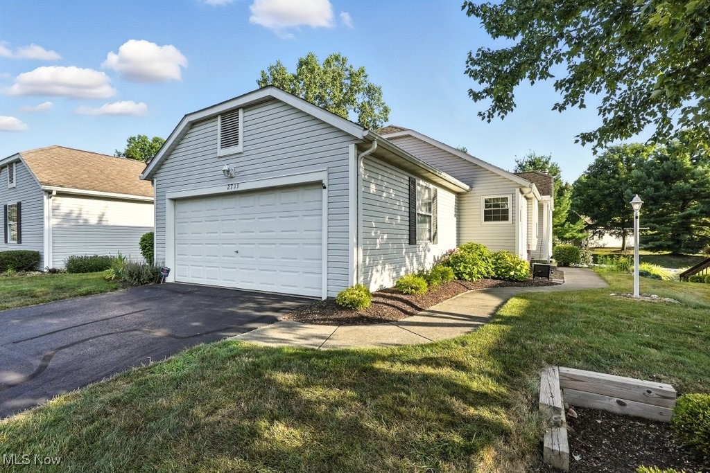 Welcome to 2713 York Dr.,  Low-Maintenance living in desirable Woodbury Condominiums!
This beautifully maintained and updated condo in Stow is located between Fishcreek and Graham Rd, with convenient access to shopping, dining, and local amenities.
This spacious home offers 2 bedrooms with the potential for a 3rd bedroom, along with 3 full bathrooms and a flexible floor plan. The eat-in kitchen features granite countertops, ample cabinetry, a pantry, and comes fully applianced. You'll love relaxing in the cozy family room with a gas fireplace and views of the private deck and backyard.
The first-floor laundry room includes a utility sink, closet, and provides easy access to the attached 2-car garage. Washer, dryer, and an additional refrigerator are included in the sale. The second bedroom and a full bathroom are also located on the main floor, offering a practical layout for guests or single-floor living.
The finished basement expands your living space with a large rec room, a brand new third full bath, and a flex room that could serve as a third bedroom, office, or hobby space. Plus, there's a separate storage/workshop area for all your extras.
Additional features include: One-year APHW home warranty included for buyer peace of mind. Hot water tank (2017)  
Don’t miss your chance to own this move-in ready condo in a quiet, well-maintained community.