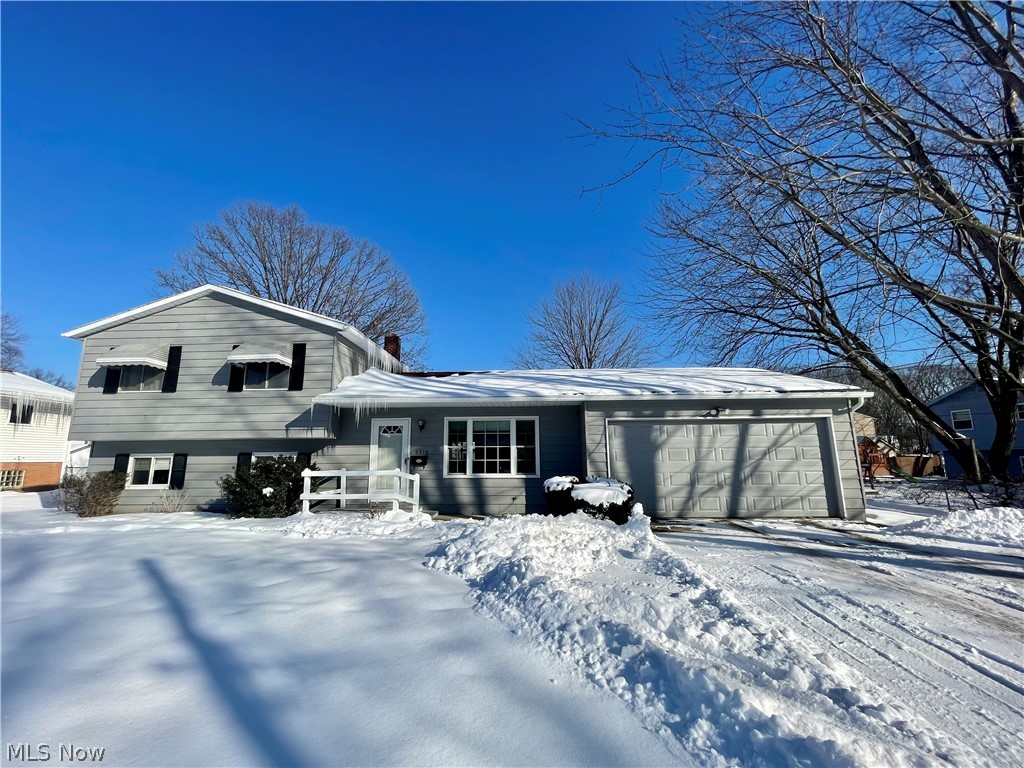 Recently updated split level is now ready for sale!  In the kitchen, you will notice brand new white cabinets installed, along with new back splash and new countertops.  Located off the kitchen and mudroom you have a spacious screened in patio with new screens and ceiling fan.  One of the best selling features is the 2 car garage in the backyard with electric.  In great condition and can be used for a few different ideas!  Down in the basement, you will find a brick fireplace with functioning wood burner equipped with blower.  Also, the second full bathroom down there has a new vanity and recently finished tile shower. Upstairs have the 3 bedrooms and a fully updated bathroom.  New vanity with his and her sink, tile floors, and the shower is finished with a trendy vinyl tile.  Not much left to do but personal touches!