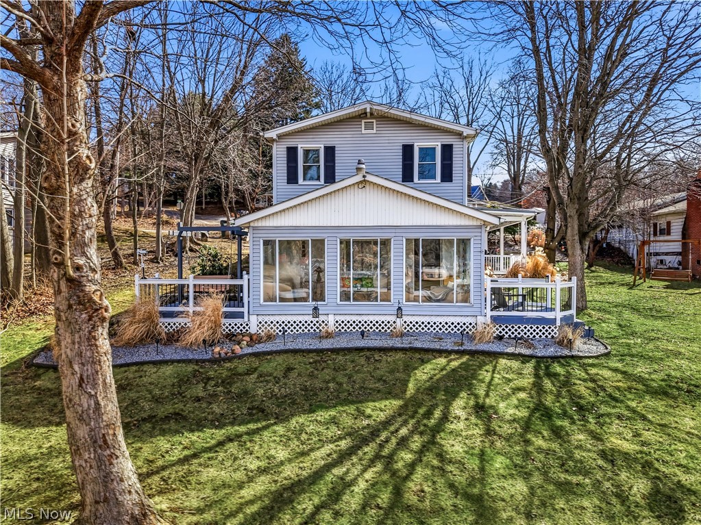 Welcome to the oasis you’ve been dreaming of—now available at Guilford Lake! This stunning waterfront home offers generous living and entertaining space with 3 bedrooms and 1.5 baths. Descend the walkway and you’re welcomed by a covered patio featuring ample seating and an outdoor TV, all overlooking the water an ideal setting for relaxing evenings or hosting friends. Step inside to an inviting eat-in kitchen, perfectly positioned for gathering, complete with a massive pantry that includes an additional refrigerator, deep freezer, and abundant shelving. Toward the rear of the home, a breathtaking floor-to-ceiling sunroom showcases panoramic lake views, creating a light-filled retreat to enjoy every season. Two sets of sliding glass doors lead to separate side porches—one with a charming swing and the other with a table and chair set offering multiple inviting spaces to unwind outdoors. The main level also features a comfortable living room, dedicated office space, half bath, and laundry area, all thoughtfully arranged for everyday ease. Upstairs, you’ll discover three nicely sized bedrooms highlighting beautiful natural woodwork and tasteful color palettes, along with a full bath and an expansive additional living/family room with direct access to the two-car garage-perfect for movie nights, a playroom, or extra entertaining space. Outside, your dock has been refinished and includes a tree swing over the water—quintessential lake living at its finest. Beautiful landscaping enhances the setting and creates the perfect backdrop for unforgettable summer nights, while most furnishings will remain to make your transition to lake life simple and seamless. All mechanical systems have been updated and/or meticulously maintained. Schedule your private showing today—and be prepared to fall in love. The Guilford Lake dam project is steadily underway, with completion scheduled for winter 2026 and full water refill anticipated by spring 2027; please visit ODNR for more info.