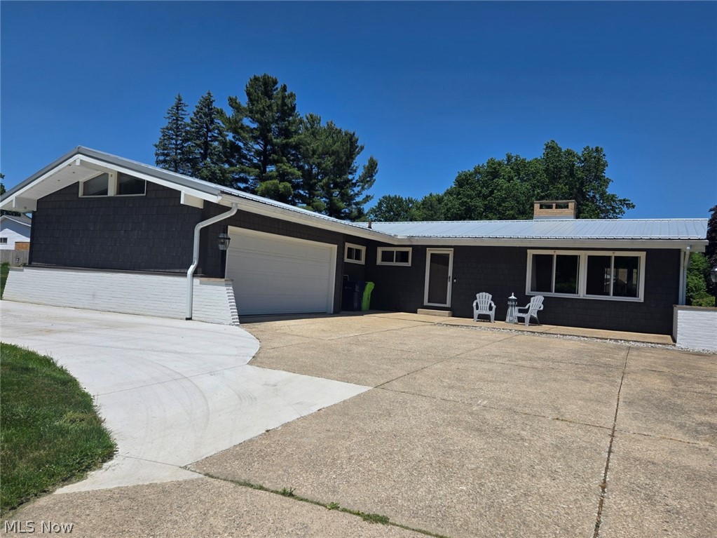 Welcome home to this beautifully updated ranch in desirable Woodland Estates! This 3-bedroom home offers the potential for a 4th bedroom in the finished basement, along with 2 full baths and an additional half bath. Natural light fills the home, highlighting the vaulted beamed ceilings and inviting living spaces.

The kitchen features brand-new appliances installed in  June 2026 and sliding patio doors added in 2021 leading to the fenced outdoor area. The primary bath includes new waterproof LVT flooring.

Major updates between 2019-2021 include the roof, siding, windows, gutters, garage door, and hot water tank. Additional 2025 improvements include concrete work and added an Extra Parking pad. 

The oversized heated garage is a standout feature with a floor drain, water access, added 220 electric service, and a second basement access. The basement offers exceptional extra living space with a full gym area, half bath, office/bonus room, laundry room, and extensive wall-to-wall storage cabinets.

A move-in ready home offering space, updates, storage, and functionality in a great location! Owner is Licensed Realtor.