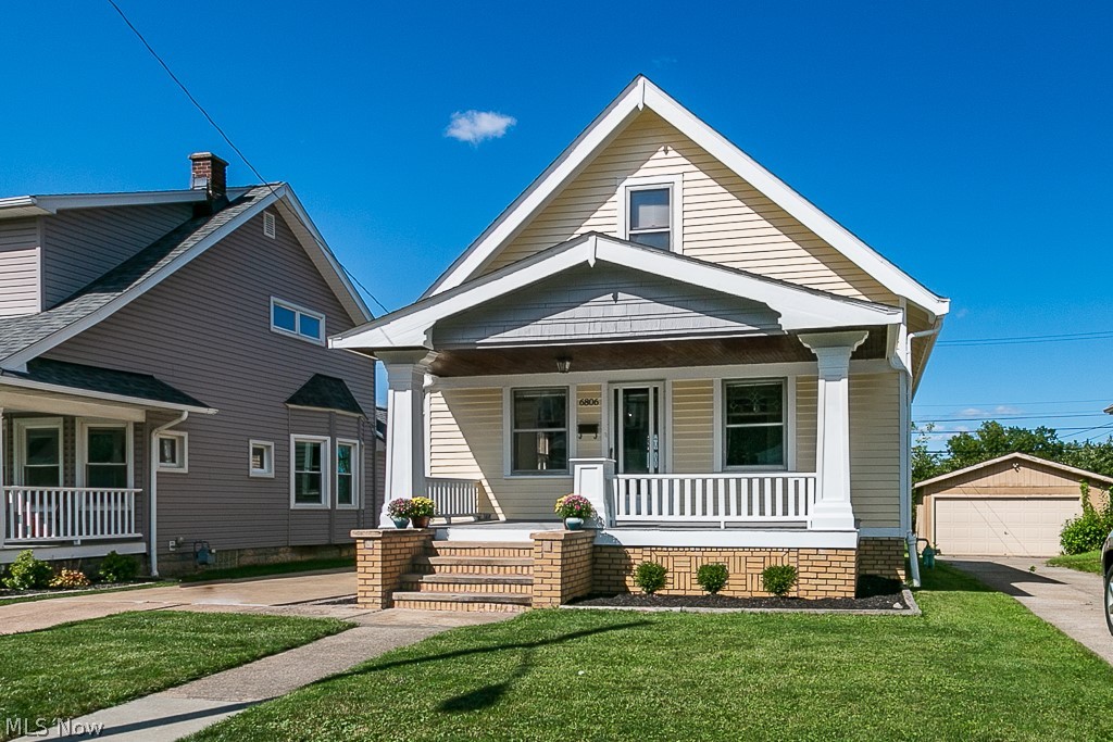 Prepare to fall in love! Very rare, this Sears-style home has been in the same family since it was built by the owner's grandfather in 1923. Meticulously maintained bungalow on a quiet, tree-lined street. Gorgeous original details abound: custom master woodwork, stunning original lead-glass windows, built-in cabinet still has original key. Dual energy source range hook-up, higher ceilings, custom screens for every window, spacious closets, custom Amish-built doors on garage, perfect plaster/drywall workmanship with smooth finishes, outstanding brick masonry, beautiful original wood corbels line the exterior roof line, original hardwood throughout, including underneath carpeted areas and the many original doors stored aside that are not in use presently but were built in 1923. New roof on house, new siding on garage, interior home is newly and freshly painted. Spotless basement is ready to become your perfect studio or hangout. Square footage includes spacious attic that's already insul