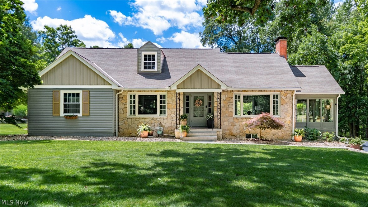 Overflowing with Charm and Character, this inviting 1-1/2 story home is located within walking distance of Zanesville Country Club with views of #10 fairway and green.  This home offers a warm blend of classic craftsmanship and thoughtful updates across 1.37 beautifully landscaped acres.  From the moment you arrive, the setting feels special-lush green grass, garden areas, mature trees, stream, and a serene koi pond creating a peaceful outdoor retreat, complimented by a delightful outbuilding perfect for hobbies, storage, or creative use.  Inside the home features two fireplaces-one anchoring the cozy living room and another adding ambiance to the lower-level family room.  A lovely sunporch is everyone's favorite with natural light perfect for morning coffee or quiet afternoons, while the formal dining room offers space for family and gatherings.  With 4 bdrs, 2 full and 2 half baths, the layout provides flexibility for family, guests, or work from home.  The lower level has the family room to enjoy or entertain with a bar area with additional space on the other side for gaming or game tables.  There are laundry facilities on main floor and also in basement area with a walkout to the back patio.  If you want to see true character, views from  beautiful windows of the ZCC #10 green, and timeless architectural details, then plan on looking at this beauty!