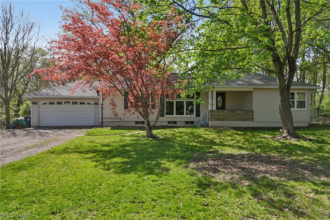 Discover the charm of this Akron home, a hidden gem that blends comfort and style with modern upgrades. Conveniently located near popular restaurants, shopping venues, and close proximity to an afternoon of leisure at Hardesty Park. This ranch-style residence offers more than meets the eye, featuring two bedrooms on the main floor, with the potential for a third, ensuring ample space for your needs. As you step inside, you’ll be greeted by an inviting atmosphere, with an abundance of natural light and hardwood floors gracing most of the main level. The home’s cozy ambiance is enhanced by two fireplaces, creating a warm and welcoming environment in the main living areas. The stylish kitchen is a standout feature, boasting upgraded cabinetry, countertops, and a breakfast bar area perfect for casual dining. Ideal for entertaining, this home offers a spacious back deck for hosting gatherings and enjoying summer days outdoors. The partially finished basement, complete with a full bathroom, provides flexible space that can be tailored to your desires—whether as an office, playroom, or personal retreat. With a walkout basement leading to a generous backyard, this home is designed to fulfill all your needs and more. Don't miss the opportunity to make this home your own!