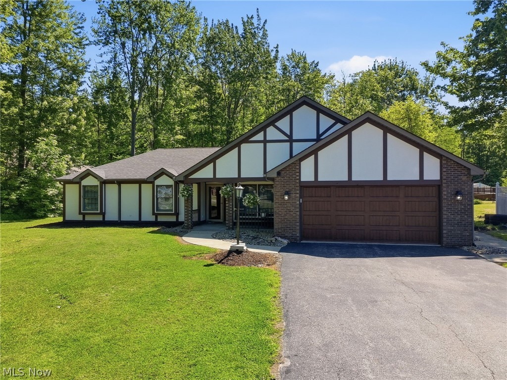 Welcome home to this beautifully updated three-bedroom, two-bath ranch situated on 2.995 mostly wooded acres. This property offers a perfect blend of comfort, space, and privacy, complete with a two-car attached garage featuring a new garage door (2025) and an additional one-car detached garage with a finished bonus room above.

Step inside to a welcoming foyer with a formal dining room, leading into a well-appointed kitchen featuring a new dishwasher, beverage refrigerator, and microwave. Just off the kitchen, the family room offers new carpet and a cozy gas fireplace, with access to a bright three-season room—perfect for enjoying the surrounding nature year-round.

The home also includes a separate living room with a second fireplace, creating additional space for relaxing or entertaining. Down the hall, you’ll find three spacious bedrooms, all with new carpet. The primary suite offers ample space, a private en suite bath, and a comfortable sitting area.

Natural light fills the home, enhancing its warm and inviting feel. Outside, enjoy a beautifully designed entertaining area with a deck, patio, and firepit—ideal for gatherings or quiet evenings.

The detached garage’s bonus room adds even more versatility, featuring new carpet, a gas stove/fireplace for cooler months, and a wall-mounted AC unit for summer comfort.

Additional updates include fresh interior and exterior paint, updated light fixtures, and a new gas hot water tank (2025). This move-in ready home offers space, updates, and a peaceful setting—don’t miss your opportunity to make it yours!