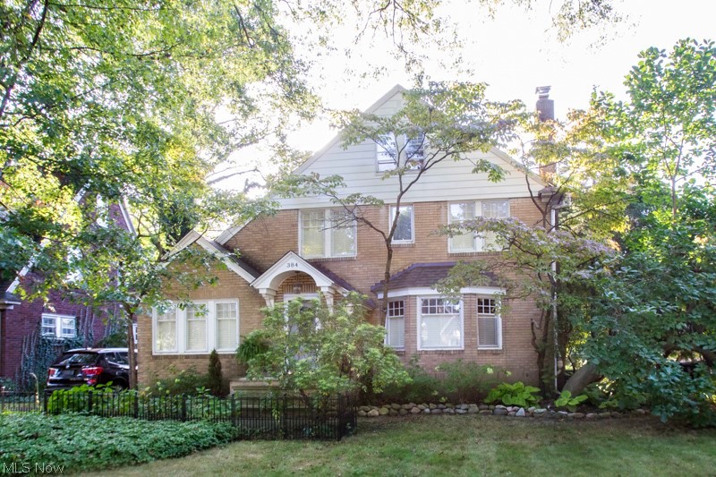 Charming brick Tudor home situated on a street lines with beautiful oak trees.  Plenty of curb appeal bolstered by the paver driveway and stone-topped porch.  Large living room and formal dining room.  Crown Molding.  Enjoy the living room with it's wood-burning fireplace.  Home features a den that can also be used as a first floor office.  Kitchen features granite countertops and an amazing farmhouse sink.  This home features hardwood floors throughout, including the attic and a roof that's being entirely replaced in 2018.  Relax on the spacious deck or on the patio in the the backyard while listening to the tranquil pond.  Tall trees offer privacy and enjoy the beautifully tended landscape.  Come and experience it all!