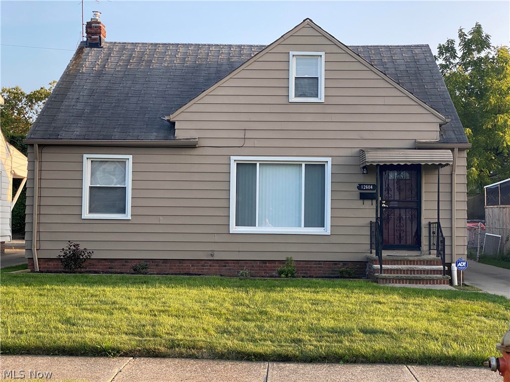 This is not your typical bungalow, it is much larger.  4 bedrooms, 1.5 baths.  The first floor features a living room, eat in kitchen , dining room, two bedrooms, a full bath, and an enclosed back porch.  Upstairs you will find 2 more bedrooms and plenty of storage.  In the lower level you will find the rec room, half bath, laundry/utility area, and a workshop.  Out back you will notice the oversized 2 car garage and workshop.  This home will not last so make your appointment today.  The roof is on order and will be replaced prior to closing.