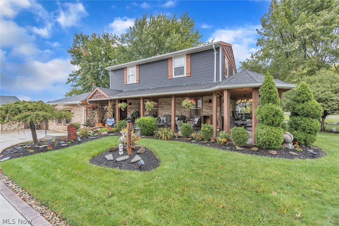 BE FIRST OR BE SORRY! Gorgeous Colonial in Brook Park offering over 2400 sq ft! This completely remodeled home offers 3 bedrooms and 1.5 baths! The exterior of the home is newer vinyl sided with cedar shake and stone wrapped around the entire porch and garage! There is a fully remodeled eat-in kitchen with a island breakfast bar, prep island, newer cabinets and pantry, granite counters, and stainless steel appliances! The first floor living room features marble floors and is surrounded by the covered cedar wrap around porch with stamped concrete and a gazebo perfect for relaxing! The lower level features a large dinning room that can seat the whole family for holidays and a cozy great room with a warming gas fireplace, bar area and extra seating for entertaining! Walk out of the family room on the the lower level stamped concrete patio and step up to an amazing covered deck with a kitchenette! The covered deck is custom built with a metal roof and cedar with a hand-made epoxy wood​​‌​​​​‌​‌​​​‌‌​​​‌‌‌​​‌​​‌‌​​​​ glaz