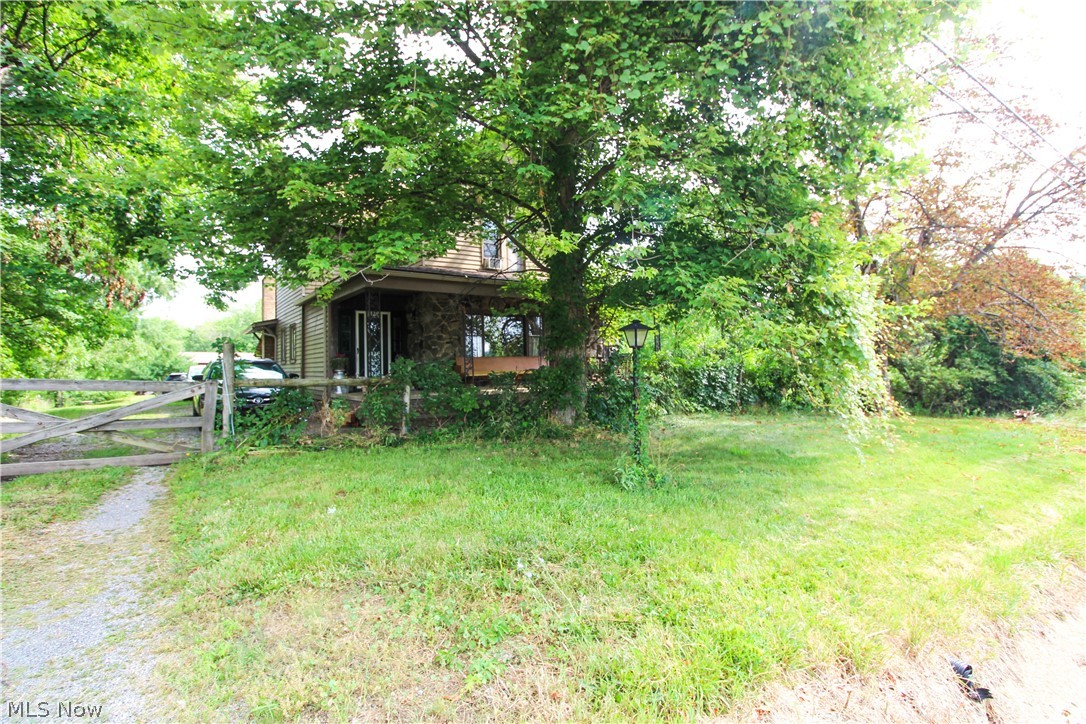 This rare property for the area, sits on 4 acres of land. It is whimsical from the roadside privacy, beautiful gardens and large barn complete with horse stables, to the charismatic design features of the interior. You will fall in love with the charm of the woodwork and beautiful bay windows that offer an abundance of natural light. This 4 bedroom, 1 and a half bath feels spacious and cozy at the same time. It has a newly updated roof as of 2023, waterproofed in 2025 and new carpet installed in 2025. Schedule a showing today and see all the character this home has to offer.
