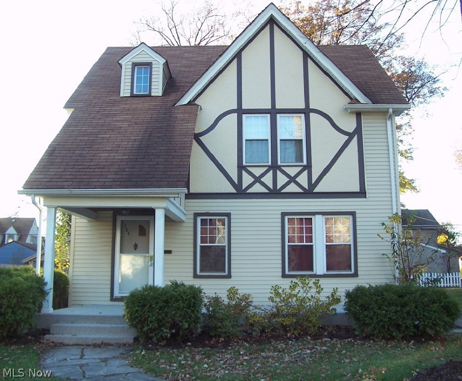 Many updates in this charming east-side Warren home.   Updates include vinyl siding, windows, kitchen,  1st fl bath & brand-new front concrete porch.  Beautiful hardwood floors, walk-up attic, enclosed back porch/patio & rec rm.  2-1/2 car garage w/ stairs to 2nd level.  Home warranty provided by seller.