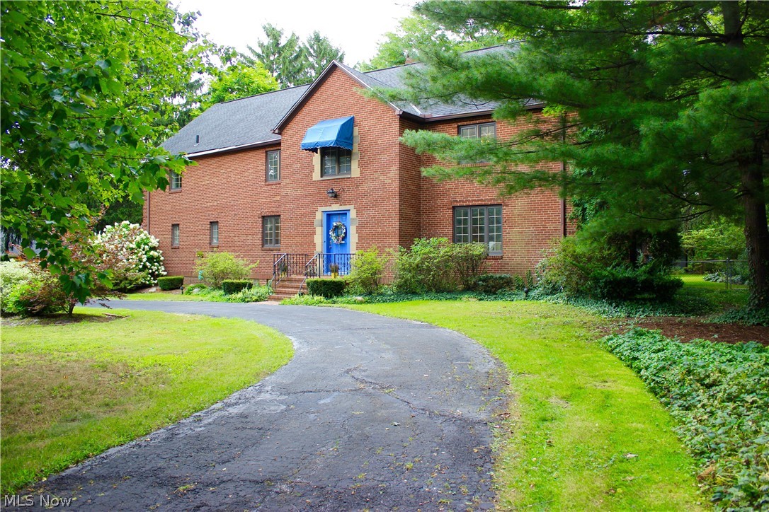ALL BRICK GRAND COLONIAL IN FAIRLAWN. 5 bedroom 5 bathroom, 3800+ sq ft. Picturesque staircases lead to the upstairs bedrooms and baths. 2 of the bedrooms have dedicated bathrooms, 2 other bedrooms share a bath. So many options for your family or guest. The 5th bedroom is currently a office. The attic is plumbed and powered for additional living space. Dedicated Library with built in bookcases and fireplace. The 4 seasons room off of the Library and Kitchen is adorned with decorative crown molding and picturesque windows framing the park like setting back yard. Off of the 4 seasons room is a multi level deck ready for entertaining. The fenced in backyard boasting .66 of an acre anchors this beautiful property. The current owner has raised her family here and now it's time for you to raise yours. Come see this gorgeous spacious Colonials in one of Akron's most desired neighborhoods.