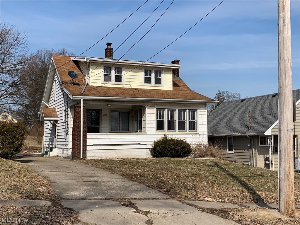 Very Spacious Aluminum & Vinyl Sided Home with a Large covered Front Porch. All original woodwork & Hardwood floors. New Kitchen cabinets.  Home will be needing a roof soon.