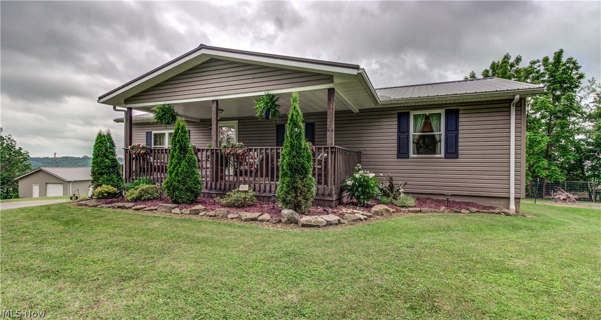Beautiful example of "Extreme Home Make Over"! Completely renovated in 2014 by a local, professional contractor, current owners have put the gorgeous finishing touches on this 3BD, 2BA, ranch home. Fabulous & Spacious kitchen with ample cupboards, countertops, stainless appliances, large pantry, breakfast bar and dining area. Large living room plus a finished family room in lower level. Full bathroom with laundry in lower level. Generator hook up with portable generator (negotiable) for when the lights go out!  Energy star windows & doors. Extra Insulation for efficiency. Two car garage at the house PLUS 28x28 detached garage. Enjoy breath taking panoramic views from sunrise to sunset of the beautiful countryside from your large back deck. Lots of wildlife. All appliances stay and furniture is negotiable. A home you'll enjoy! Includes million dollar views at no extra cost! New schools in Fall of this year.