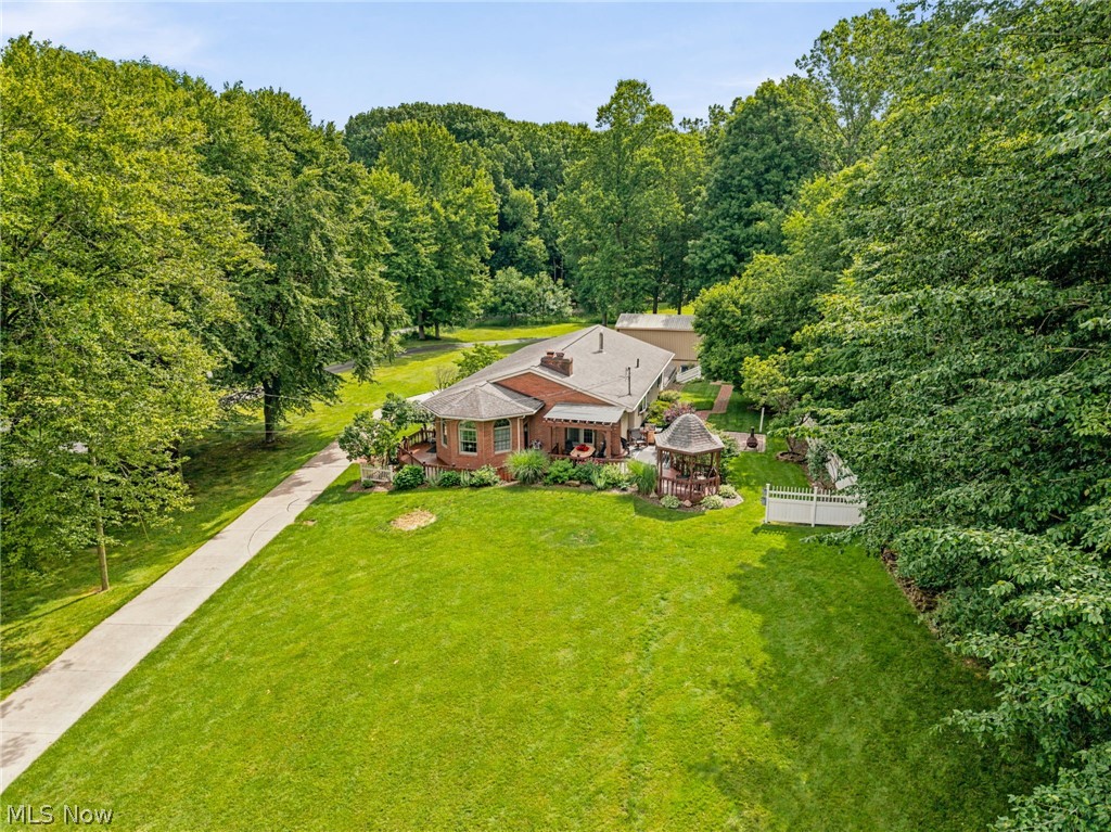 Welcome home to 1600 Deerford! This meticulously maintained one owner home offers the perfect blend of privacy, convenience, and detailed craftsmanship. Beautiful woodwork and thoughtful finishes create warmth and character throughout, while the kitchen features elegant quartz countertops and details you simply have to see for yourself. A bright sitting room surrounded by windows provides the perfect place to relax during the cooler months, while the freshly stained deck is ideal for enjoying peaceful spring, summer, and fall mornings and evenings.
Outside, the oversized hobby barn opens up endless possibilities for projects, storage, entertaining, or pursuing your favorite hobbies. Major mechanical updates, including a newer A/C, furnace, and hot water tank, add comfort and peace of mind. This is a rare opportunity to enjoy quality, space, and charm in a setting that feels both private and convenient.