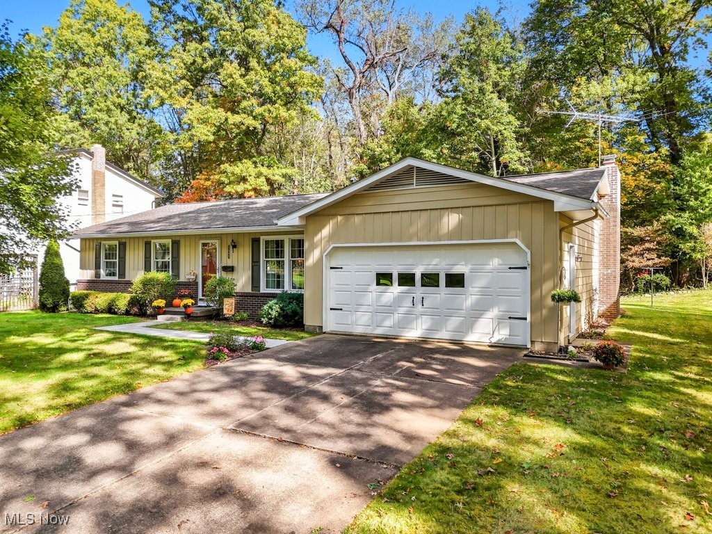 Welcome to this beautifully maintained ranch home in one of Kent’s most desirable neighborhoods! Just minutes from Kent State University’s main campus, this charming residence is tucked away on a quiet dead-end street lined with trees and sidewalks, with not one but two nearby parks to enjoy.

Lovingly cared for by the same owner for 40 years, this 3-bedroom home offers timeless appeal and thoughtful updates throughout. Most rooms (bedroom, dining and living) feature original hardwood floors (some under carpet), and the primary suite includes a private bath renovated in 2018 with a new shower, vanity, LVT flooring, commode, and lighting.

The formal living and dining rooms provide great space for entertaining, while the eat-in kitchen—with its newer appliances—opens to a cozy family room highlighted by a wood-burning fireplace with a new liner and damper (2023). From here, sliding doors lead to a roomy 3-season room—perfect for casual dining or simply watching the abundant wildlife in the tranquil backyard. Step outside to enjoy the patio and the serene, wooded views of the adjacent university-owned land.

Additional features include a large basement with plenty of storage and laundry area (washing machine purchased in 2025 and dryer stay), and an attached two-car garage. Major updates include: furnace (2024), roof (2014), A/C (2013), hot water tank (2012), windows (2012), and full exterior painting (2018).

Ranch homes in this location rarely come available—schedule your showing today and see why this neighborhood is so loved!
