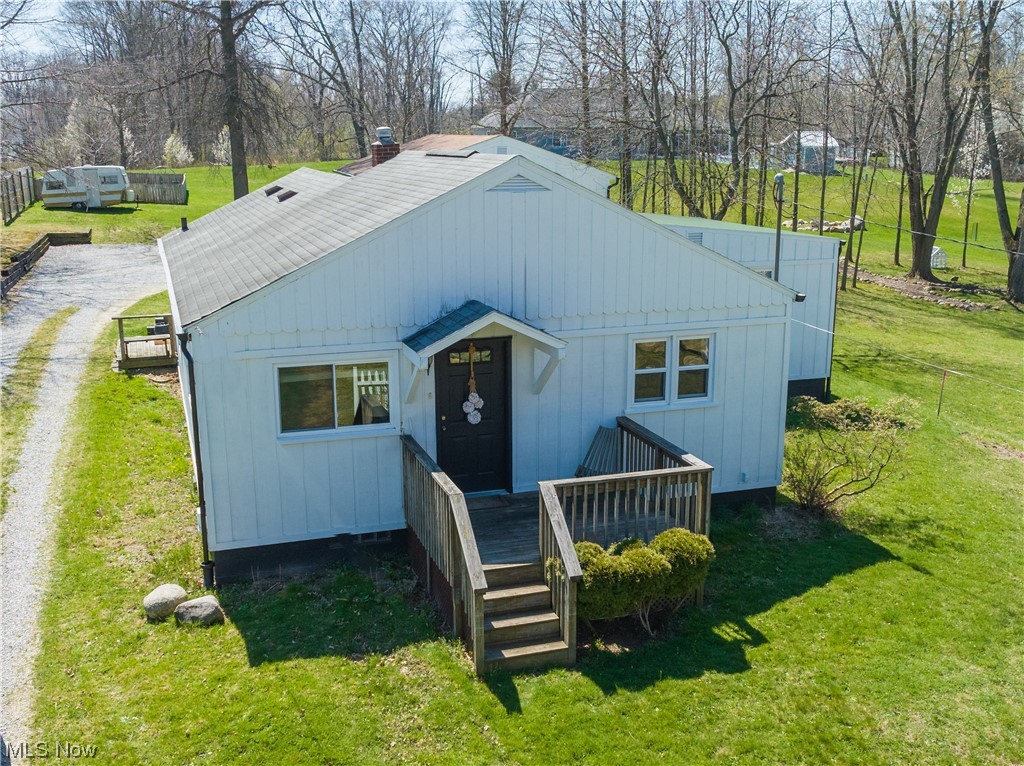 BACK ON MARKET, DUE TO NO FAULT OF THE SELLERS. Lovely 3 bedroom, 1 bath ranch with lots of updates and ALL appliances stay!  This is a rare find in Tallmadge with over an acre of land! Original hardwood floors in the living room, and under the kitchen floor. Updated bathroom, new paint throughout, and spacious bedrooms. Master bedroom has a great additional area for an office, nursery, or even first floor laundry. Set back off the road for privacy, the parcel stretched from Eastwood Ave all the way to the road behind.  Large 3 car garage with gas, water, and electric to hold all the toys and tools. Has  Very large fenced garden ready for all your summer veggies. End your evenings on the enclosed back porch and enjoy the views! This one is a must see! Upgrades include Furnace/AC, Porch Roof, Gutters/downspouts, kitchen countertops, bathroom and flooring. Basement has recently been waterproofed with a sump pump added.  Lifetime warranty.  Basement is also plumbed for an additional bathr