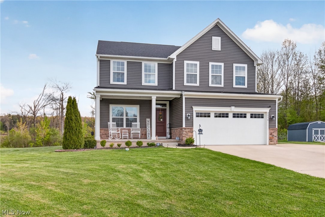 Welcome to this beautifully updated 2019 Columbia model offering over 3,000 finished square feet of living space in the heart of Grafton! Located just minutes from Midview Local schools, this 4-bedroom, 2.5-bath home features an open and functional floor plan with extensive upgrades throughout. The entire first floor showcases stunning luxury vinyl plank installed in 2023, complemented by fresh Sherwin-Williams paint throughout the home. The kitchen is a true centerpiece featuring elegant Calacatta quartz countertops, an oversized center island, and a stainless steel farmhouse sink. All appliances stay!

The spacious finished basement adds incredible additional living and entertaining space complete with a custom bar area and brand new carpet(2025). Upstairs, the oversized owner's suite offers a massive walk-in closet that truly must be seen to appreciate, along with a beautifully appointed en-suite bathroom featuring a Roman shower. The second floor also includes three additional spacious bedrooms, a full bathroom, and a conveniently located laundry room with added cabinetry for extra storage and functionality. 

Step outside to enjoy the large, private lot with an expansive backyard- the composite deck and stamped concrete patio are perfect for relaxing or entertaining. A wooden playset and trampoline (both 2025) make the backyard complete. Extra large driveway addition for additional parking in the front. This move in ready home combines modern updates, generous living space, and an unbeatable location all in one package. Call today for your showing!