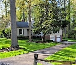 Tranquil living at its finest... Wonderful 3 bedroom 3 full bath cape cod on just over an acre - the setting is absolutely picturesque with wooded tree lines and a rolling hillside. Considerably larger than it appears, the interior boasts gleaming hardwood floors, crown molding, solid panel doors, large rooms and a warm, welcoming feel. Spacious living room with custom shelving and a wood burning fireplace. The formal dining room with built in corner cabinets is just off the kitchen and provides ample room for those large family gatherings and holiday dinners. The eat in kitchen is centrally located and provides access through sliders to the rear deck. The sprawling great room with cathedral ceiling and loads of natural sunlight is the perfect place to relax or entertain. Convenient first floor office. Fabulous first floor master bedroom with cathedral ceiling, access through sliders to a rear deck, an enormous walk in closet and en-suite bathroom. Two nicely appointed bedrooms and a f