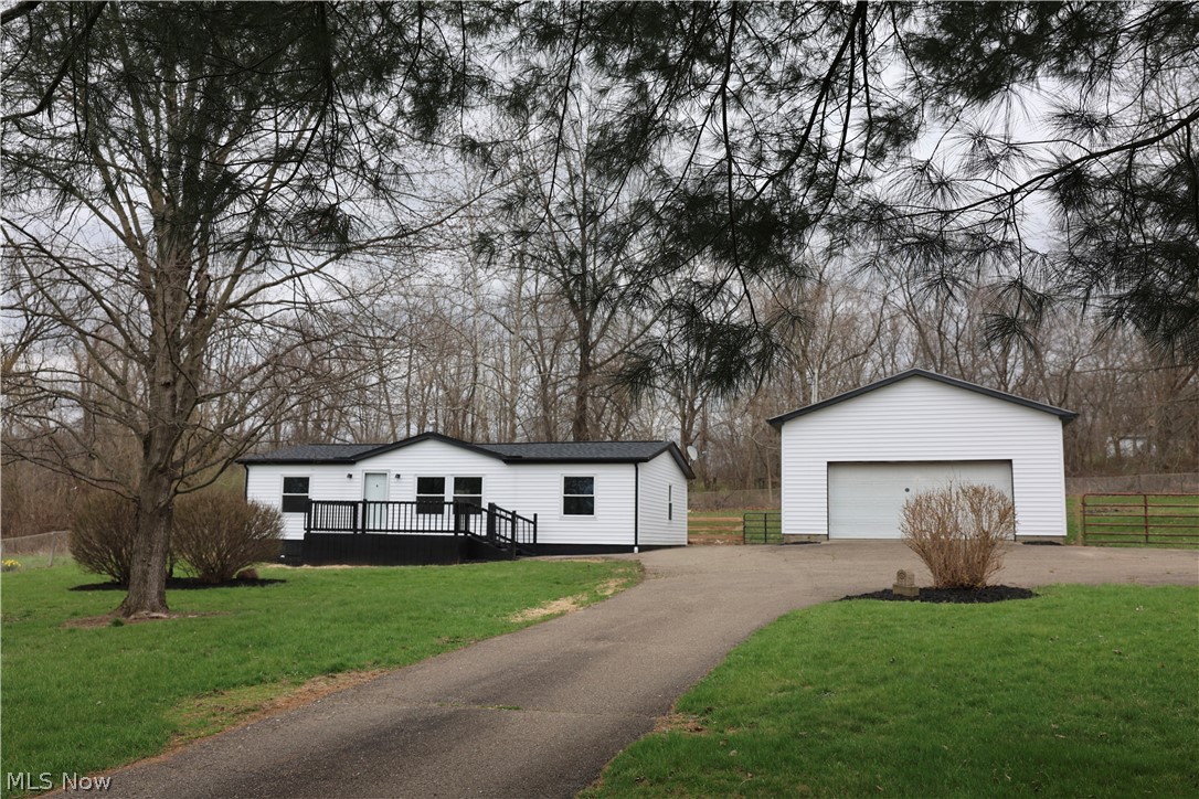 Affordable, remodeled one floor living in rural western Holmes County. This home offers an open floor concept along with 3 bedrooms and 2 full bathrooms. His home has a new roof, siding, flooring, lights, outlets, countertops, paint, culvert and some new fence. The detached garage is 24'x24' plus a small patio area behind it. Great location between Millersburg and Wooster. There has been a major oil spillage from a neighboring property that went across this property. The EPA is involved and guarantee a safe report.