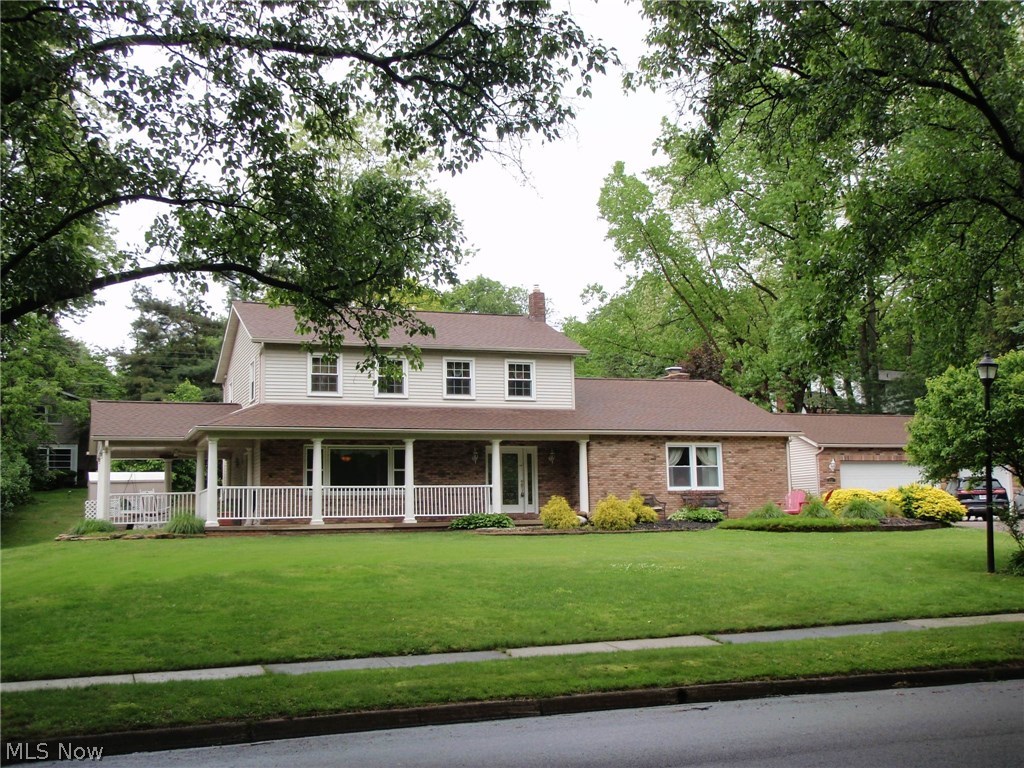 Updated colonial fit for a King. This home has shown much love to those who have entered through the leaded glass front door. No worry of places to sit for entertaining. It has a covered porch on the side of the house with fans,  a covered front porch plus a patio.  Red brick court yard with many perennials and grape vines with arbor.  Inside you will find 4 bedrooms, updated 2 1/2 baths (another full bath in finished basement).   Hardwood floors, newer windows, 
 5 yr old siding and roof.  Also newer furnace and central air conditioning(2yrs old)   3 car garage with cabinets for any car buff.   Like to cook? Then you will love this oversized kitchen with granite countertops and large island,plus walk in pantry.   Supersized family room with fireplace.  A wonderful place to call your home.